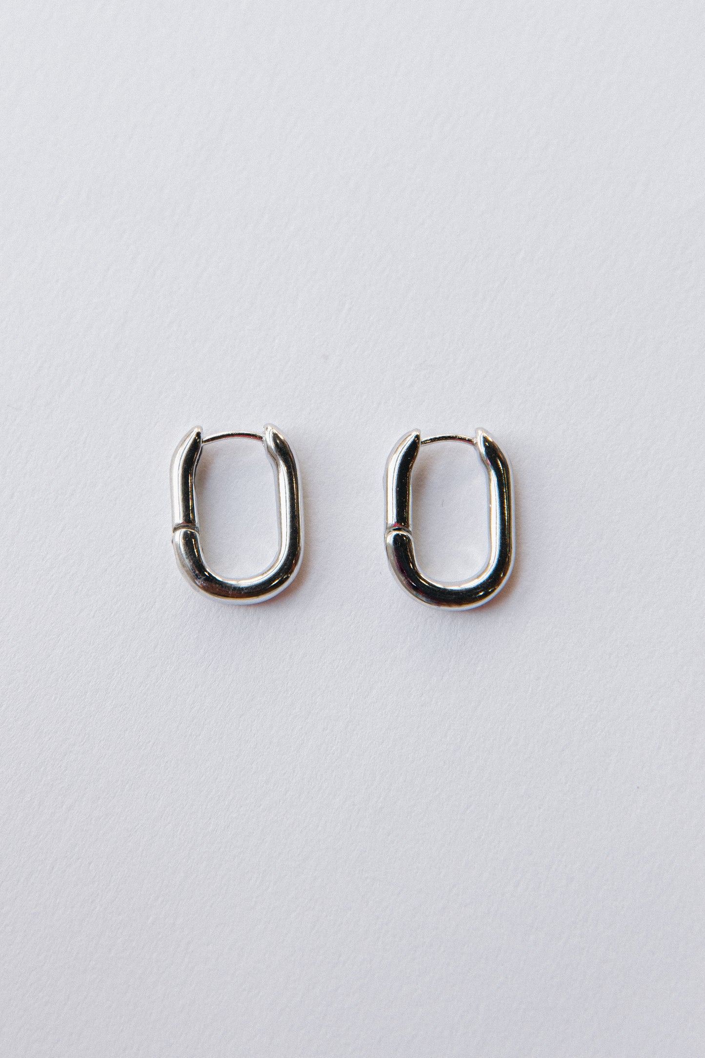 Gold oval hinged hoops