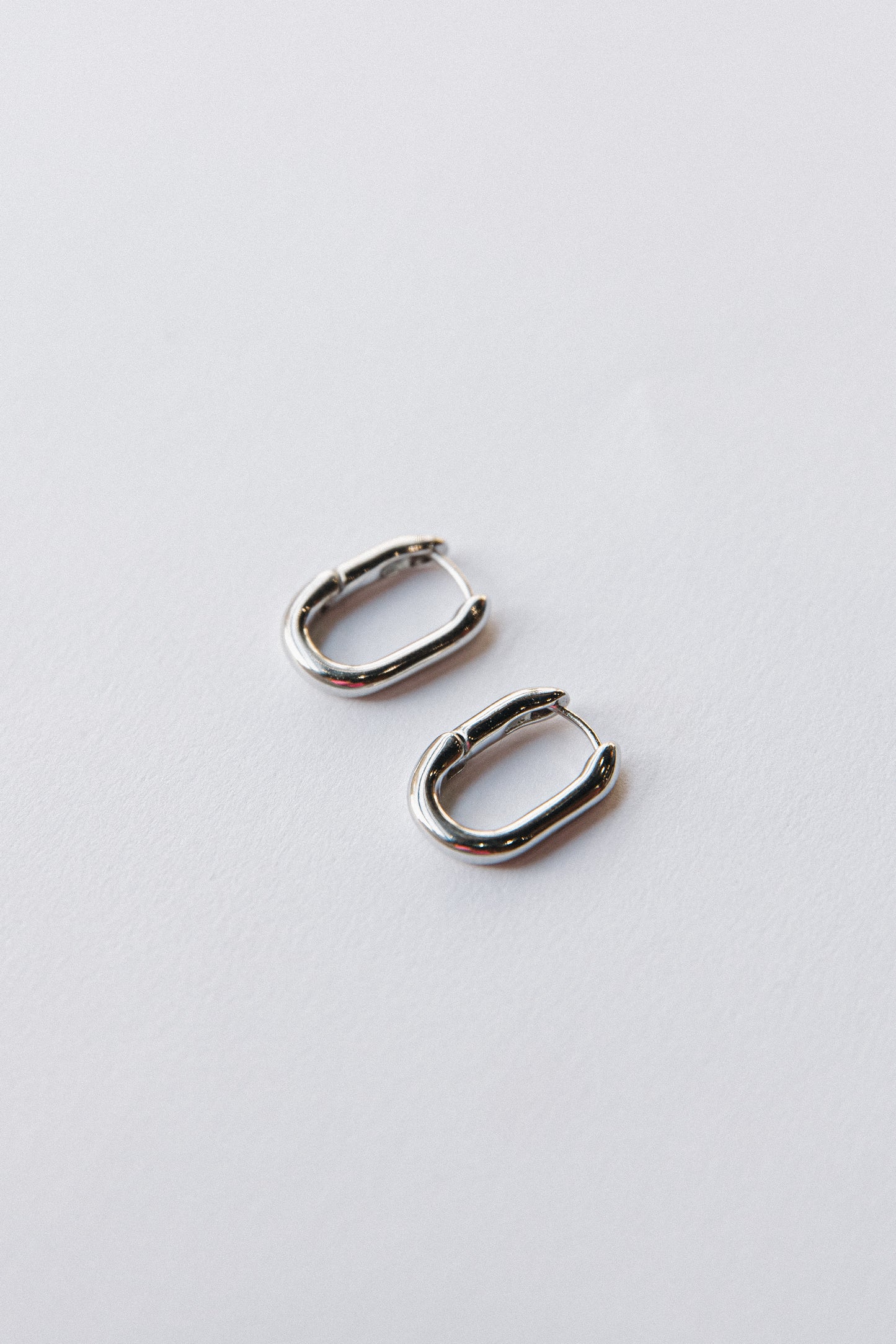 Gold oval hinged hoops