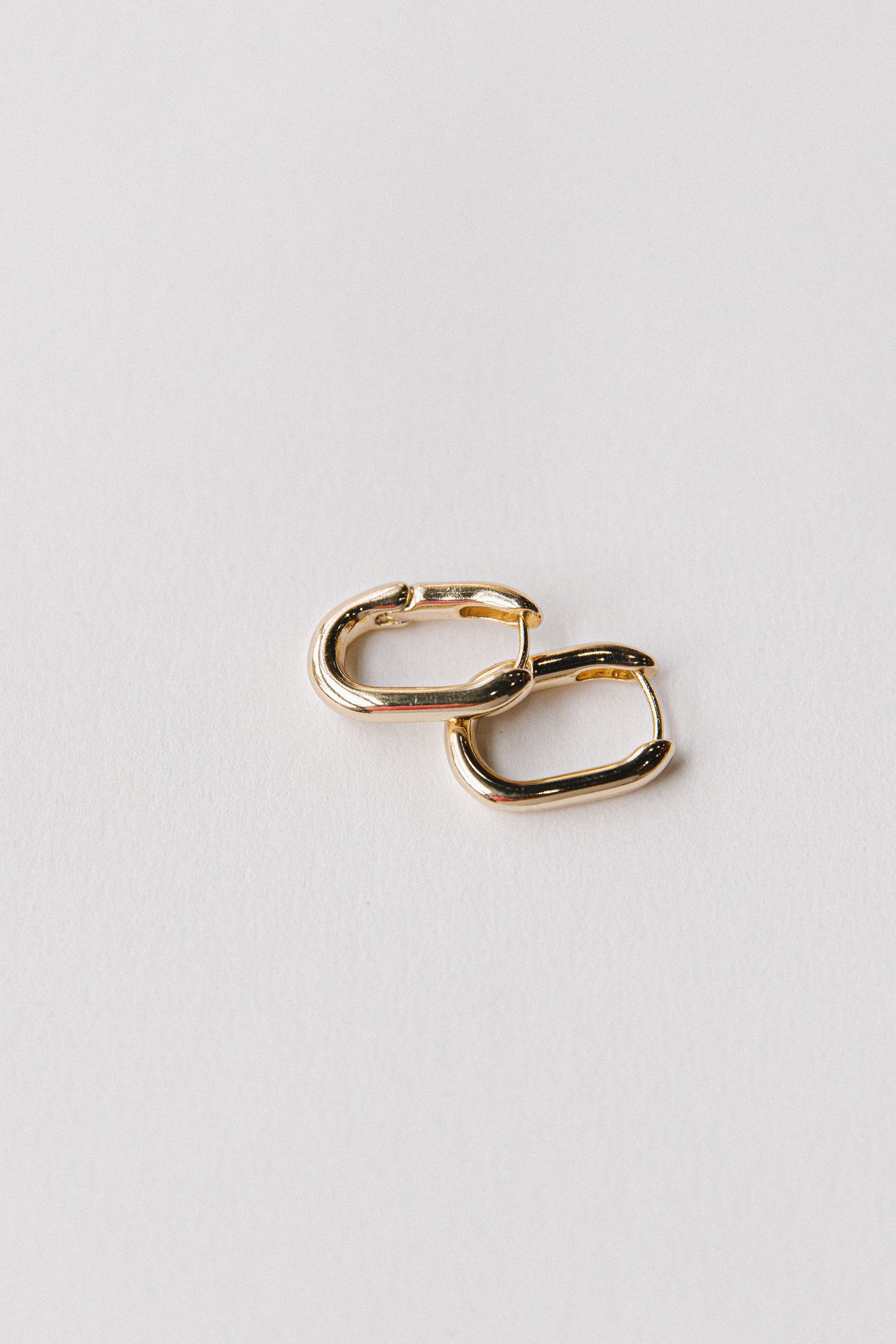Gold oval hinged hoops
