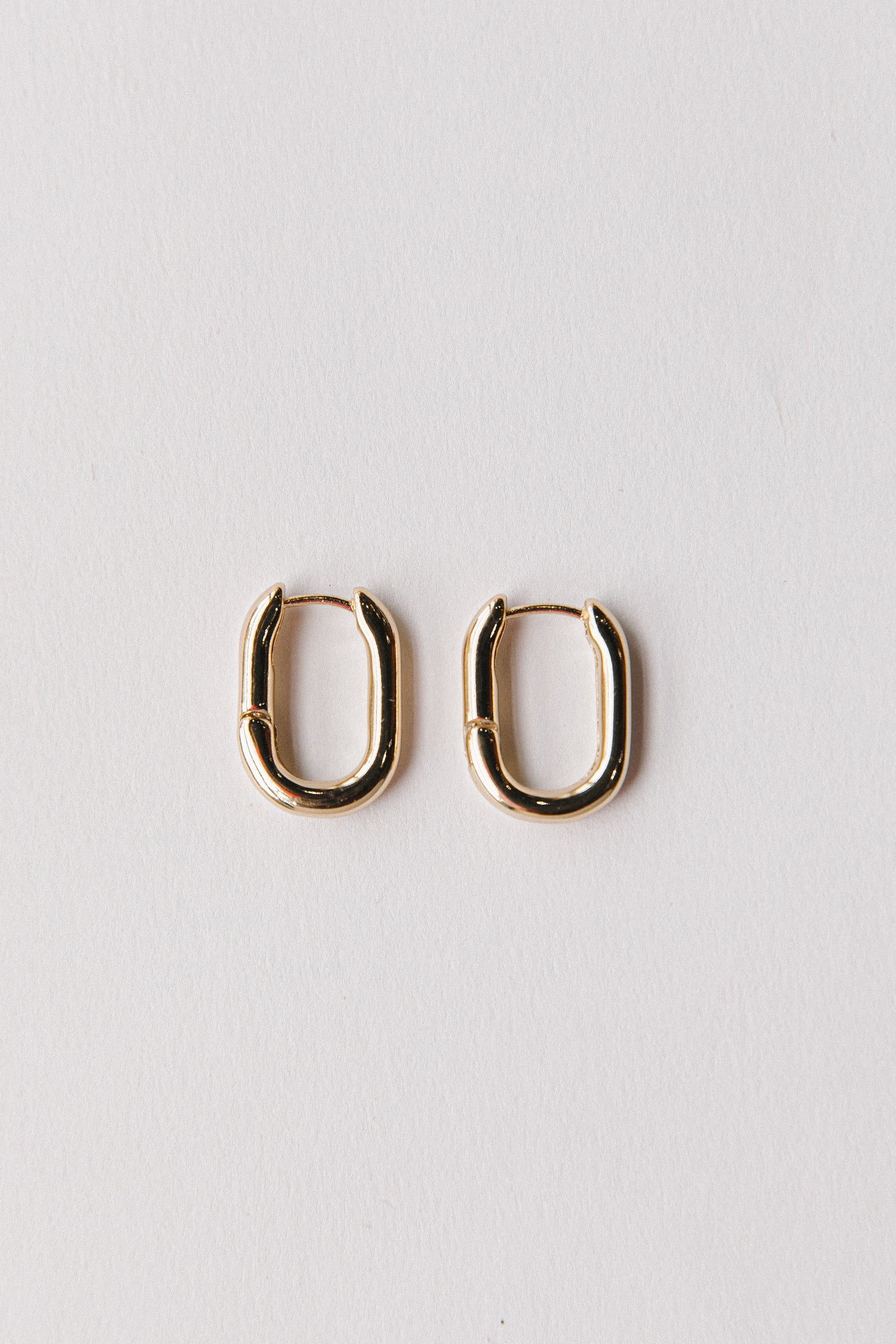 Gold oval hinged hoops